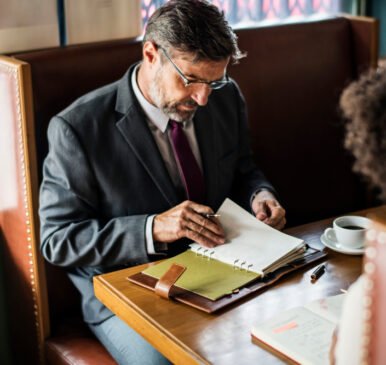 &ldquo;New Jersey business attorney reviewing LLC formation documents with a client during consultation.&rdquo;