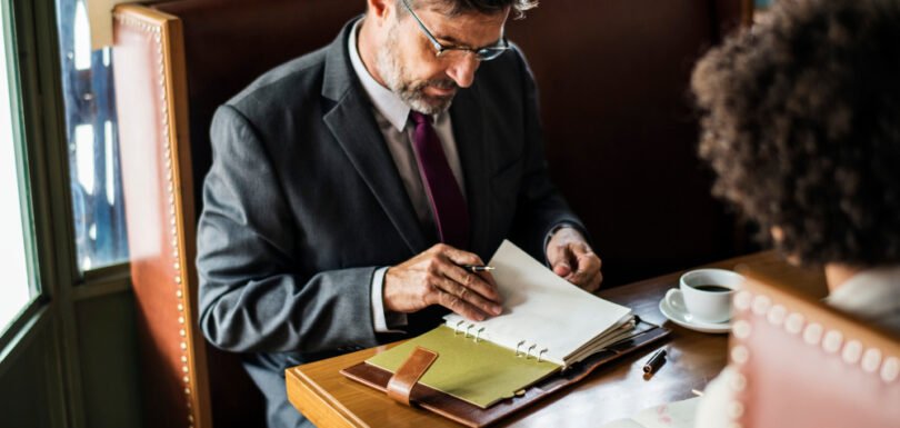 &ldquo;New Jersey business attorney reviewing LLC formation documents with a client during consultation.&rdquo;