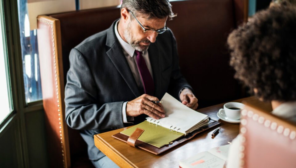 “New Jersey business attorney reviewing LLC formation documents with a client during consultation.”