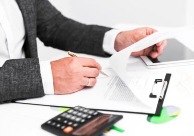 “Business attorney in New Jersey reviewing financial documents and contracts for commercial debt collection support.”