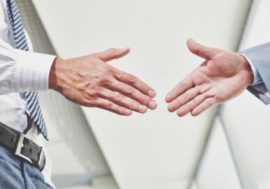 “Partnership Disputes – Business Litigation & Mediation Attorney in New Jersey”793 Hands of two business professionals reaching out for a handshake, symbolizing agreement and partnership in business transactions.