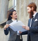 Showing new contract Business merger attorney