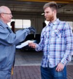 mechanic-giving-keys-car-customer_329181-11862