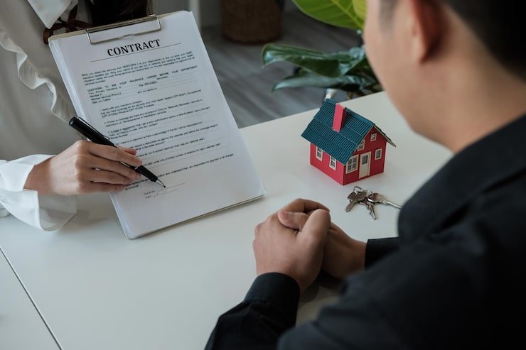 real-estate-brokers-point-contract-paper-advise-customers-sign-their-names-customer-sign_696265-3271 real-estate-brokers-point-contract-paper-advise-customers-sign-their-names-customer-sign_696265-3271